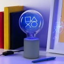 Playstation Lampka na biurku w tle książki i długopis